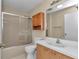 Standard bathroom featuring a shower/tub combo, a toilet, and a single sink vanity with storage at 2608 Botello Ave, The Villages, FL 32162