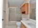 Standard bathroom featuring a shower/tub combo, a toilet, and a single sink vanity with storage at 2608 Botello Ave, The Villages, FL 32162