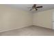 A roomy bedroom boasts plush carpeting and a modern ceiling fan at 2608 Botello Ave, The Villages, FL 32162