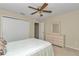 Well-lit bedroom featuring carpet, a ceiling fan, and a dresser at 2608 Botello Ave, The Villages, FL 32162