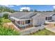 Charming home with an attached garage and a quaint front yard with a white picket fence at 2608 Botello Ave, The Villages, FL 32162