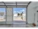 The garage featuring an open garage door allowing a view of the neighborhood at 2608 Botello Ave, The Villages, FL 32162