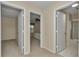 Hallway featuring access to a bedroom, bathroom, and other rooms at 2608 Botello Ave, The Villages, FL 32162