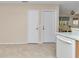 Bright kitchen featuring tile floors and a dining area at 2608 Botello Ave, The Villages, FL 32162