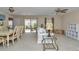 Open concept living room with a dining area and access to the patio at 2608 Botello Ave, The Villages, FL 32162
