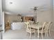 Bright living space features neutral tones, carpet floors, and a combination living/dining room at 2608 Botello Ave, The Villages, FL 32162