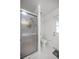 Bathroom featuring a glass door shower and a toilet at 2671 Sw 158Th Lane Rd, Ocala, FL 34473