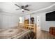 Bright bedroom featuring a rustic bed set, wood laminate flooring, and a closet at 2671 Sw 158Th Lane Rd, Ocala, FL 34473