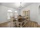 Elegant dining room with modern lighting, a stylish table, and large windows for natural light at 2671 Sw 158Th Lane Rd, Ocala, FL 34473