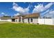 Beautiful home exterior with manicured lawn, arched entryway and a two-car garage at 2671 Sw 158Th Lane Rd, Ocala, FL 34473