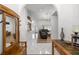 Inviting home foyer with high ceilings, white tile flooring, a wooden hall tree and open concept layout at 2671 Sw 158Th Lane Rd, Ocala, FL 34473