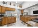 Well-lit kitchen featuring granite countertops, stainless steel appliances, and open layout at 2671 Sw 158Th Lane Rd, Ocala, FL 34473