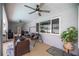 Covered lanai featuring comfortable seating, ceiling fans, and serene outdoor views at 2671 Sw 158Th Lane Rd, Ocala, FL 34473