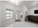 Bright living area with door to the pool, tile flooring, and ample natural light at 2671 Sw 158Th Lane Rd, Ocala, FL 34473