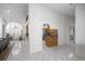 Bright, open-concept living space with tile floors, flowing seamlessly between living, dining, and kitchen areas at 2671 Sw 158Th Lane Rd, Ocala, FL 34473