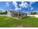 Screened-in pool area with a beautiful pool and lush landscaping at 2671 Sw 158Th Lane Rd, Ocala, FL 34473