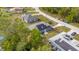 Aerial view showcasing a house featuring solar panels and a spacious lot, in a tree-lined neighborhood at 30 Bahia Trace Loop, Ocala, FL 34472