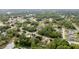 Birds-eye view of the home and neighborhood surrounded by a beautiful, dense canopy of trees at 30 Bahia Trace Loop, Ocala, FL 34472