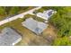 Aerial view of a home with solar panels surrounded by lush trees in a residential neighborhood at 30 Bahia Trace Loop, Ocala, FL 34472