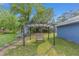 View of a backyard with lawn, mature trees, and a gazebo at 30 Bahia Trace Loop, Ocala, FL 34472