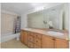 Bathroom features double sink vanity, tile flooring and shower over tub at 30 Bahia Trace Loop, Ocala, FL 34472