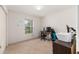 Bedroom with a window, carpet, closet, gaming chairs and desk at 30 Bahia Trace Loop, Ocala, FL 34472