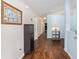 Inviting hallway with wood floors, leading to various rooms and featuring stylish decor at 30 Bahia Trace Loop, Ocala, FL 34472