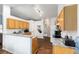 Well-lit kitchen with wood cabinets, granite countertops, and modern appliances, offering a functional layout at 30 Bahia Trace Loop, Ocala, FL 34472
