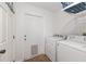 Laundry room features a door to outside, washer, and dryer at 30 Bahia Trace Loop, Ocala, FL 34472