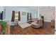 Comfortable living room with a plush couch and chair, natural light, and stylish decor at 30 Bahia Trace Loop, Ocala, FL 34472