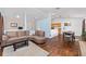 Open living space with cozy living room, wooden dining table, and kitchen featuring wood cabinets at 30 Bahia Trace Loop, Ocala, FL 34472