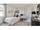 Whimsical bedroom with a moon mural, unique lighting, and modern black and white accents at 3066 Canopy Oak Blvd, Wildwood, FL 34785
