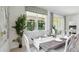 Elegant dining room with a view of the backyard and stylish window treatments at 3066 Canopy Oak Blvd, Wildwood, FL 34785