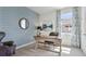 Bright home office with modern furnishings, shiplap accent wall, and plenty of natural light at 3066 Canopy Oak Blvd, Wildwood, FL 34785