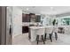 Modern kitchen with stainless steel appliances and a spacious center island at 3066 Canopy Oak Blvd, Wildwood, FL 34785
