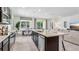 Open kitchen featuring a large island, stainless steel appliances, and adjacent dining area at 3066 Canopy Oak Blvd, Wildwood, FL 34785