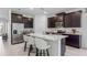 Modern kitchen with stainless steel appliances and a spacious center island at 3066 Canopy Oak Blvd, Wildwood, FL 34785