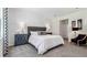 Elegant main bedroom featuring a tufted headboard, custom nightstands, and decorative wall paneling at 3066 Canopy Oak Blvd, Wildwood, FL 34785