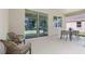 Relaxing outdoor patio with comfortable seating and a view of the lush backyard at 3066 Canopy Oak Blvd, Wildwood, FL 34785