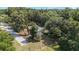 Secluded home featuring mature trees and landscaping on a spacious lot with a private driveway at 4701 Nw 60Th Terrace, Ocala, FL 34482