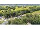 An aerial view showing a home surrounded by lush trees and open green spaces at 4701 Nw 60Th Terrace, Ocala, FL 34482