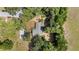 Overhead view of a home with mature trees and landscaping on a sunny day at 4701 Nw 60Th Terrace, Ocala, FL 34482