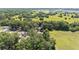 A high angle aerial view of a house nestled among trees with grassy fields nearby at 4701 Nw 60Th Terrace, Ocala, FL 34482