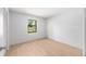 Bedroom features wood-look flooring and a window providing lots of natural light at 4701 Nw 60Th Terrace, Ocala, FL 34482