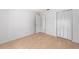Bedroom features wood-look flooring and closet with bifold doors at 4701 Nw 60Th Terrace, Ocala, FL 34482