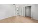 Bedroom features wood-look flooring with bathroom and closet access at 4701 Nw 60Th Terrace, Ocala, FL 34482