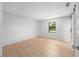 This bedroom features wood-look floors and a window providing lots of natural light at 4701 Nw 60Th Terrace, Ocala, FL 34482