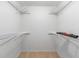 Walk-in closet featuring white wire shelving and wood-look floor at 4701 Nw 60Th Terrace, Ocala, FL 34482