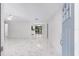 Spacious living room flows into kitchen with tiled floors and natural light at 4701 Nw 60Th Terrace, Ocala, FL 34482