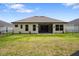 Well-maintained backyard featuring lush green grass at 6235 Sw 95Th Pl, Ocala, FL 34476